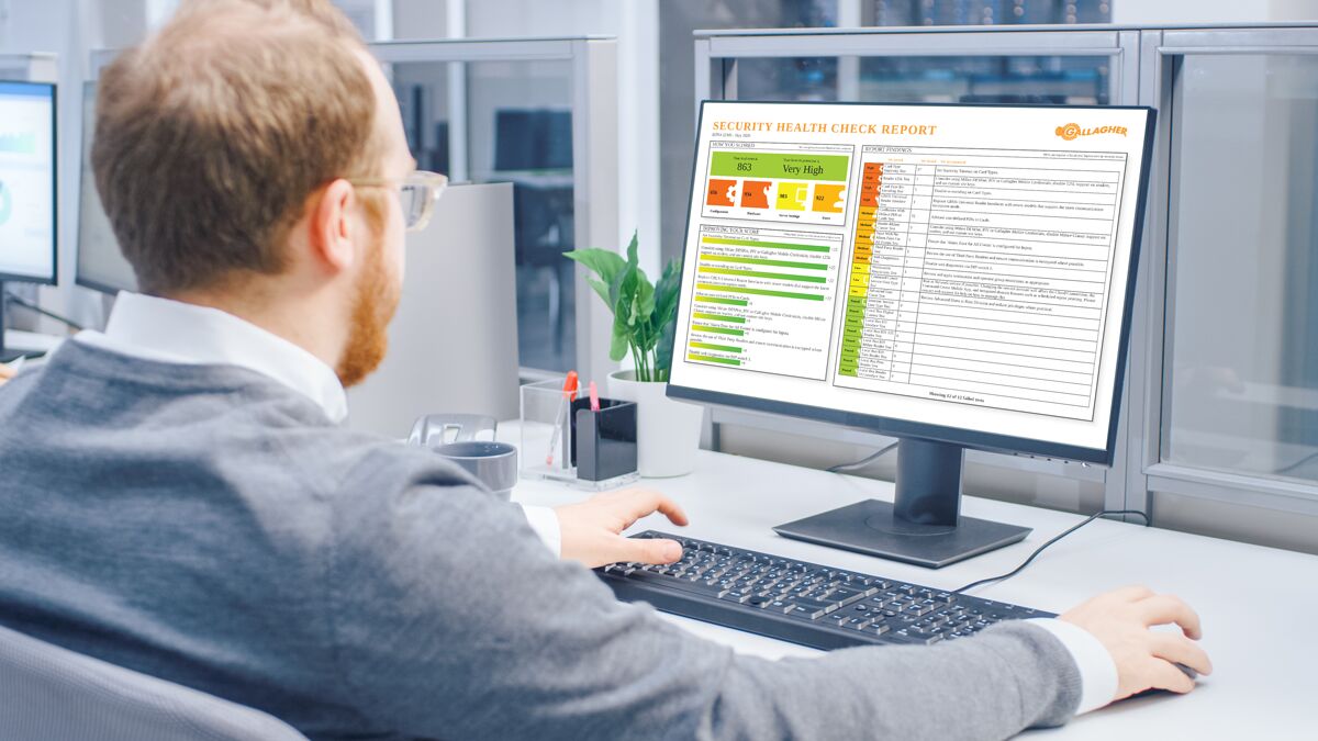 security-health-check-blog-hero-image-General Purpose Person at computer completing a security health check