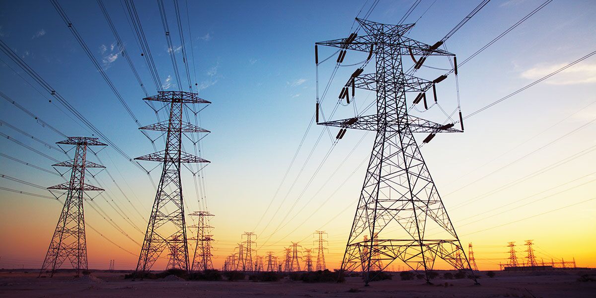 Power lines and towers at sunset