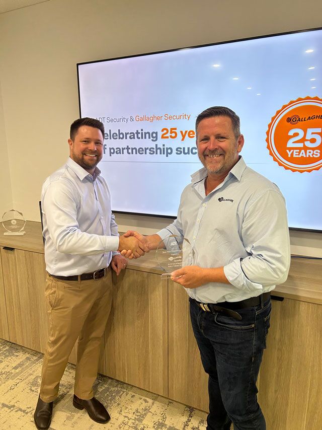 Gallagher ADT 25 year partnership-General Purpose L - Geoff Campbell-Brown R - Scott Johnstone