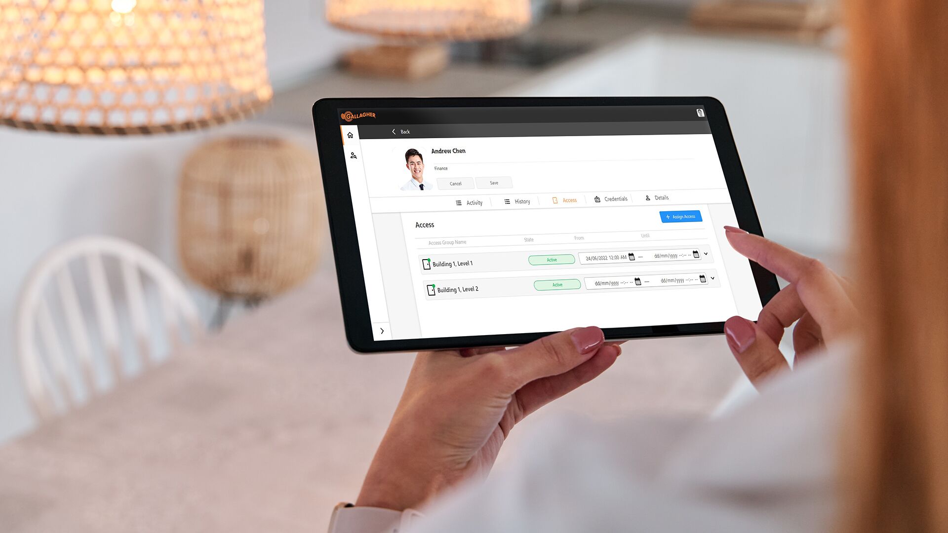 Command Centre Web - Hero Image - RGB Low Res for WEB (Cropped)-General Purpose Woman using an app on her smartphone to control the lighting in her smart home. Concept of internet of things, home automation and new technologies.