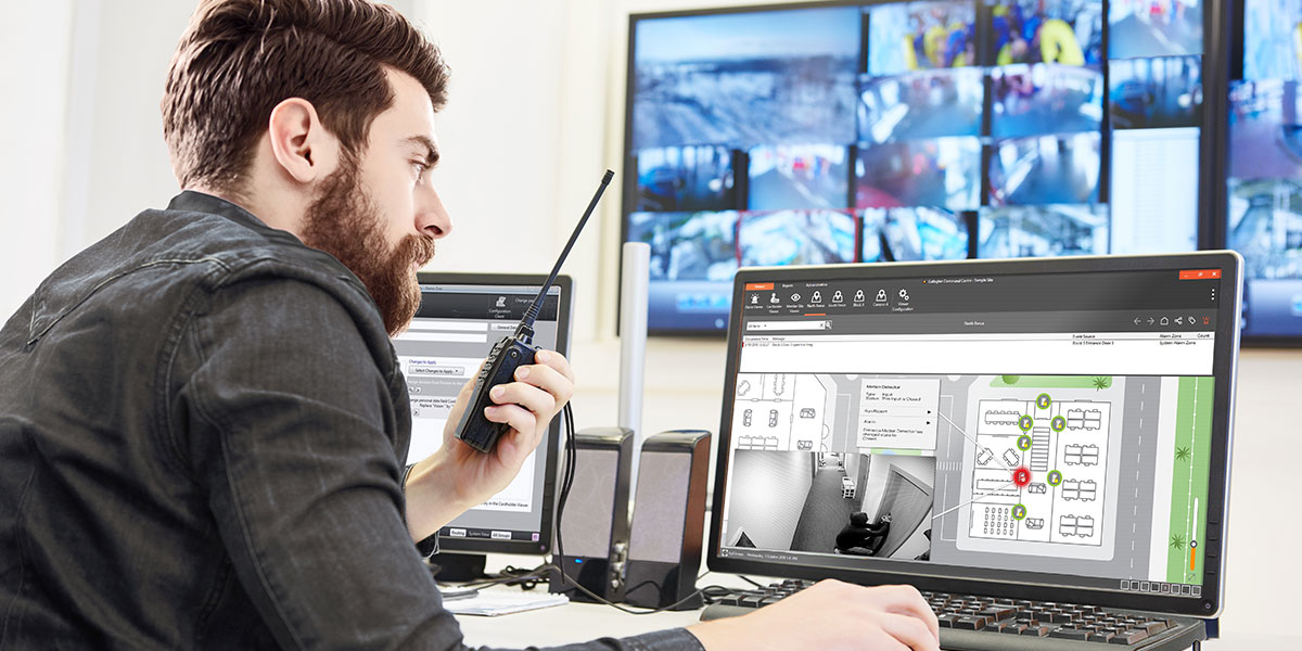 security guard watching video monitoring surveillance security system