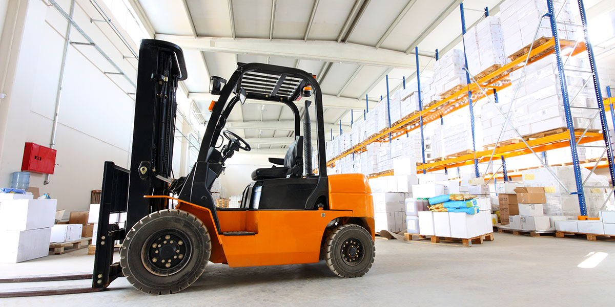 Orange forklift in factory