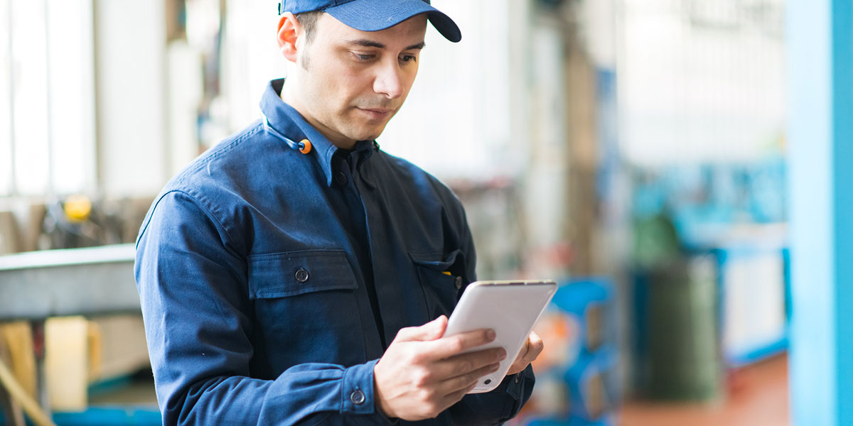 Security installer looking at electronic device