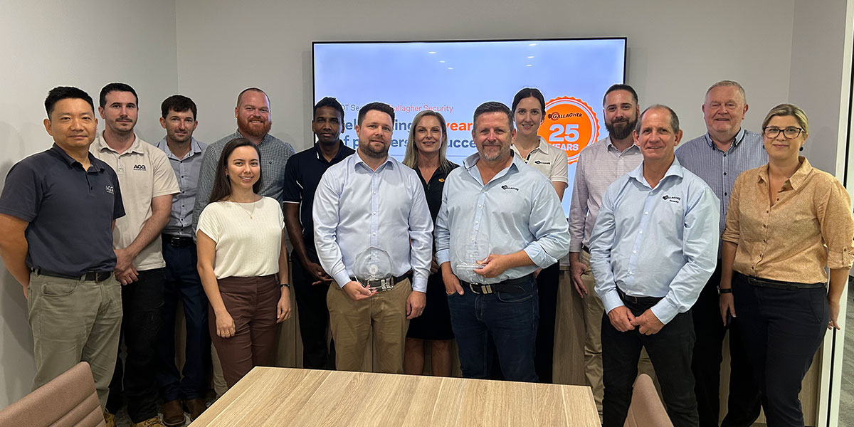 Gallagher and ADT Teams pose for photo celebrating 25 year partnership anniversary