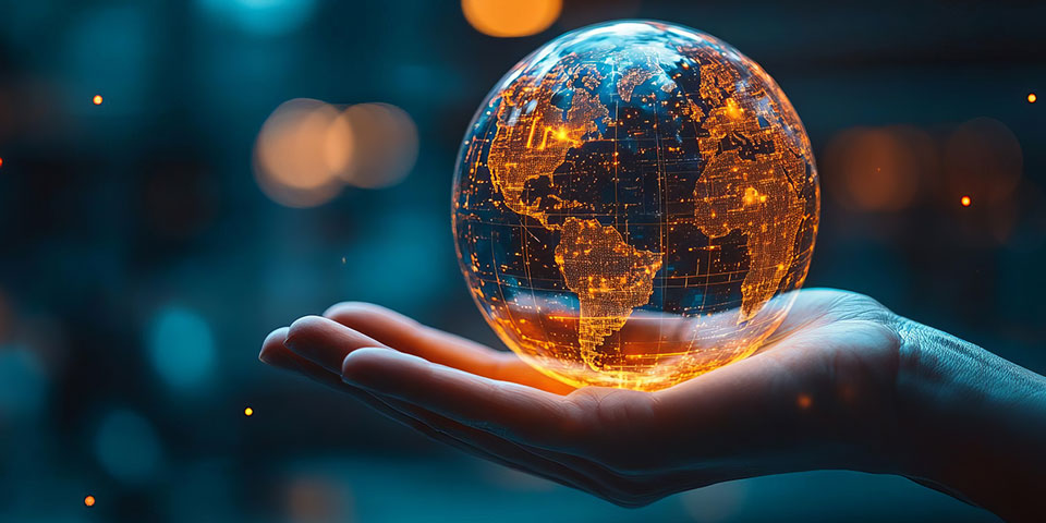 globe with data connection lines in the palm of someone's hands