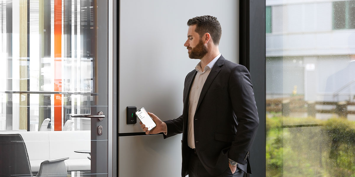 Employee badging at reader with mobile access control credential