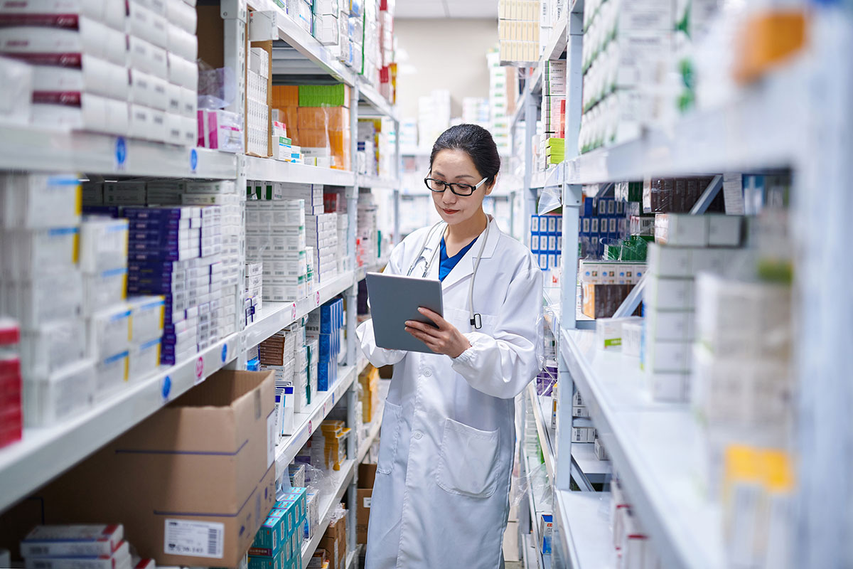 Pharmacist taking inventory