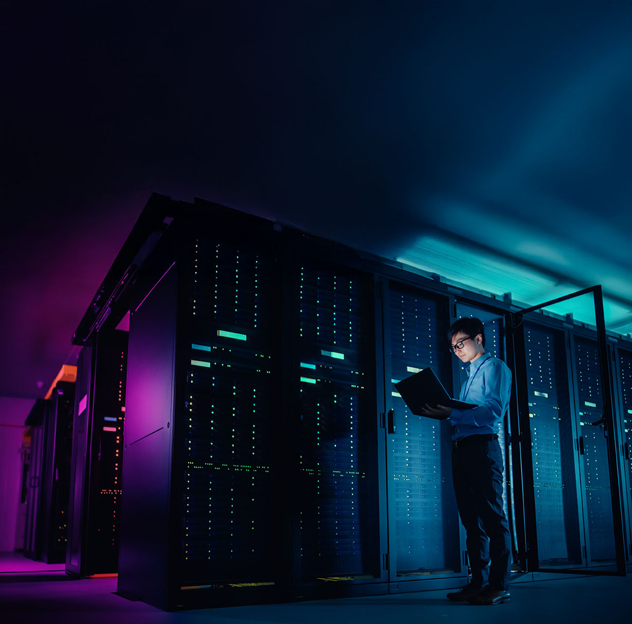 Technician working on tenant server at colocation data center