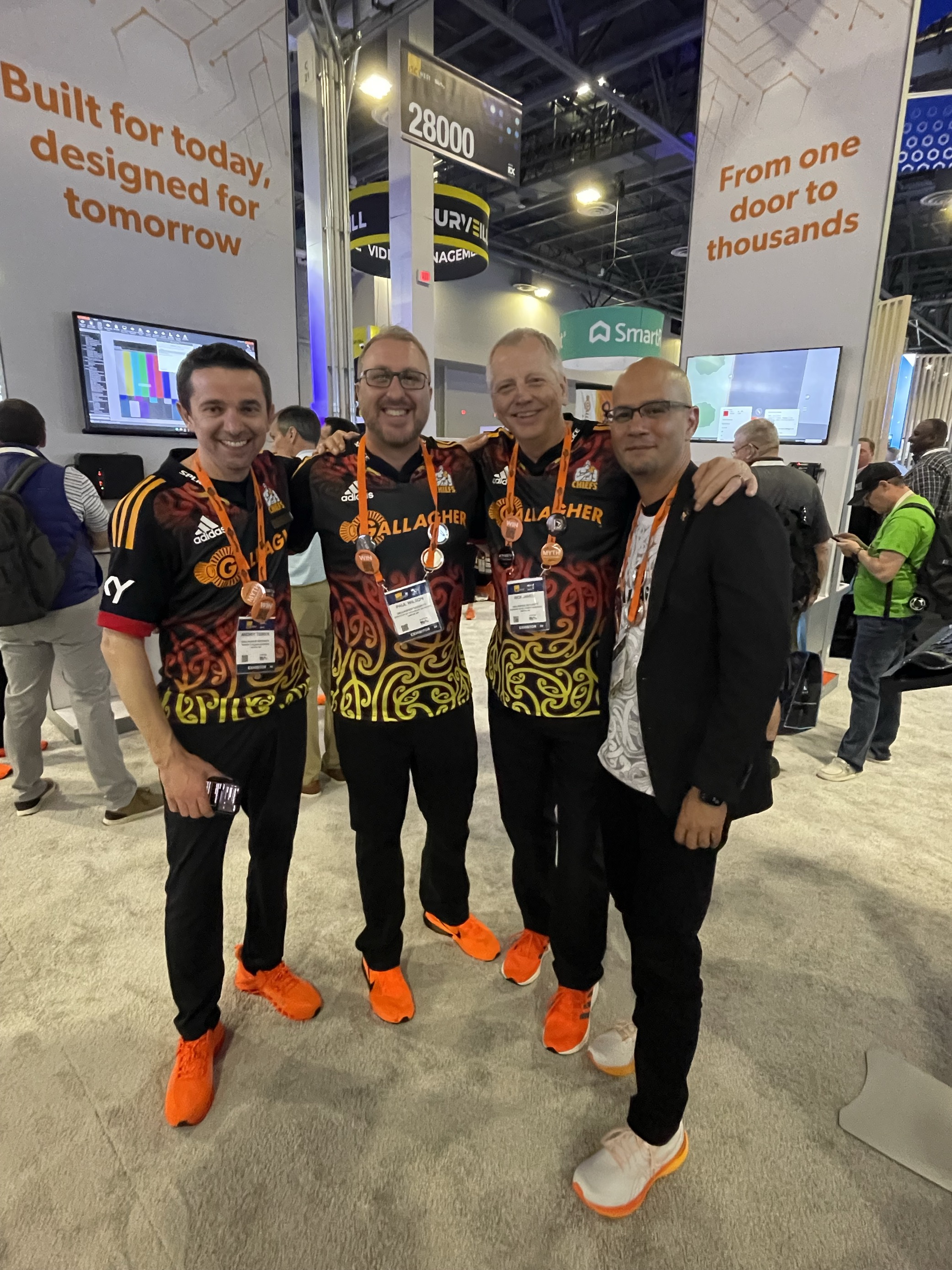 Andriy Tsinyk, Paul Wilson, Rick James, and Luis Colon at the Gallagher Security stand at ISC West 2024